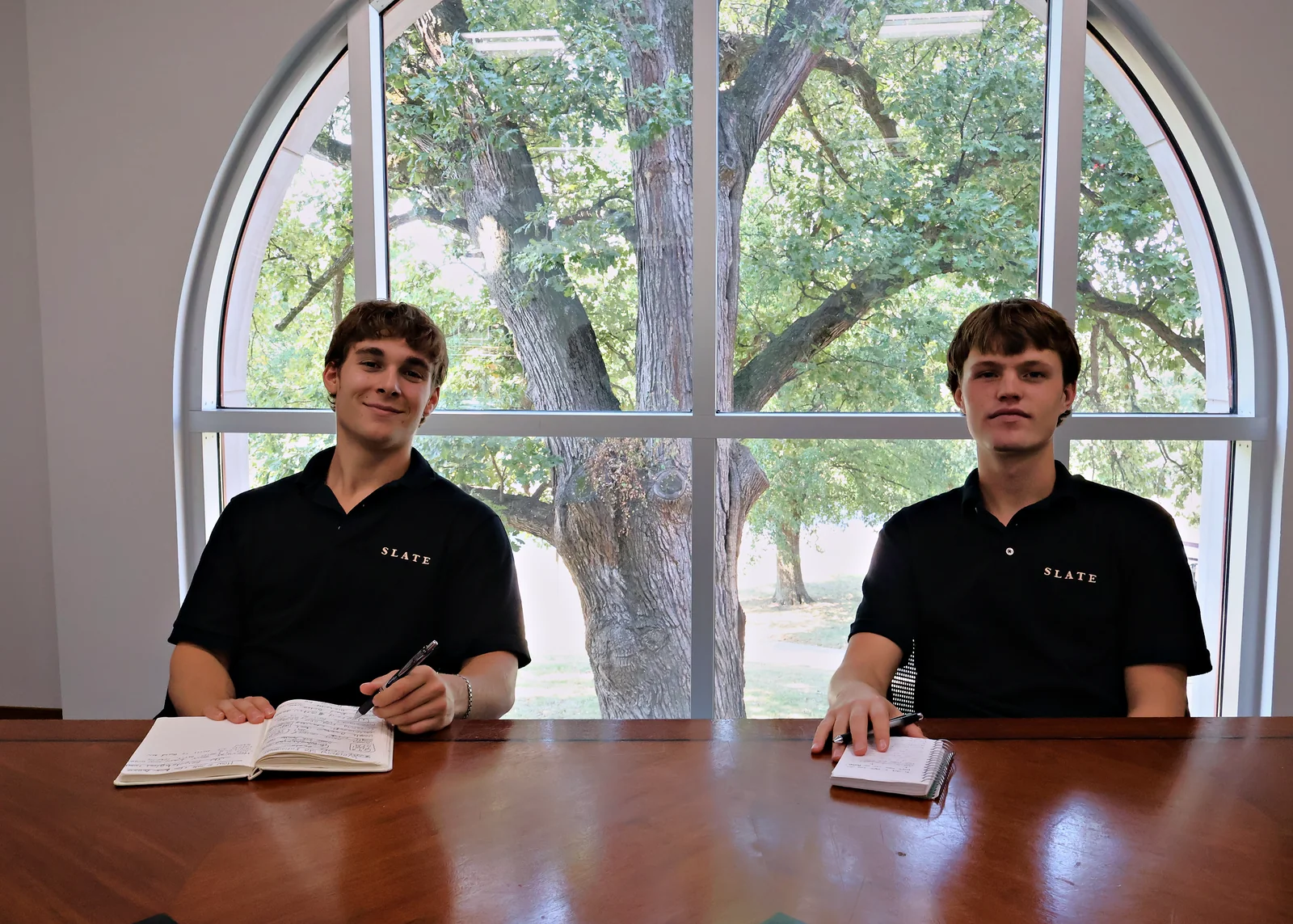 Jack Moutardier and Daxton Noe at the conference table